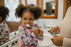 Tips To Help You Brush Your Toddler’s Teeth (plus answers to 5 FAQs)